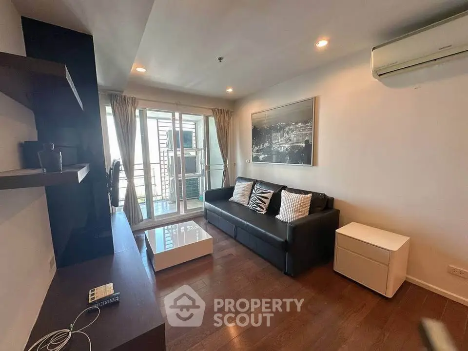 Modern living room with balcony access and stylish decor