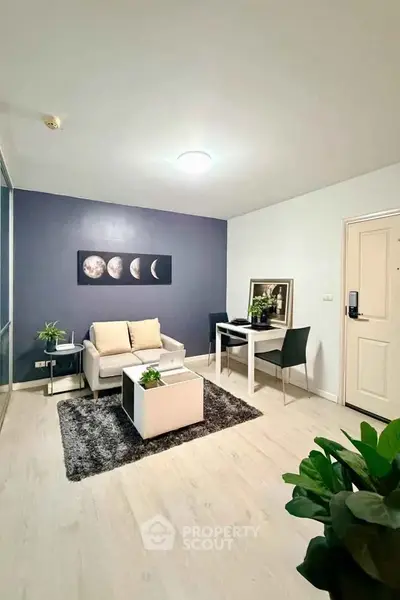 Modern living room with stylish decor and cozy seating area, perfect for relaxation and entertaining.