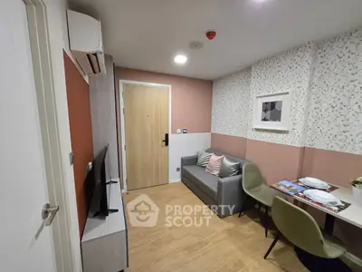 Modern living room with stylish decor and compact furniture, perfect for urban living.