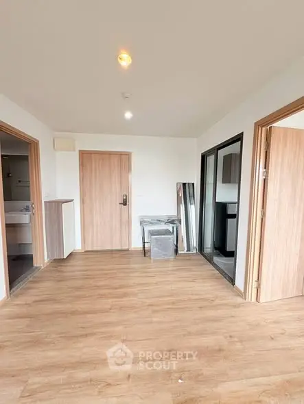 Spacious modern apartment interior with wooden flooring and open layout
