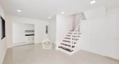 Modern minimalist interior with sleek staircase and open layout