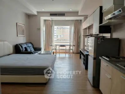 Spacious studio apartment with modern furnishings and natural light