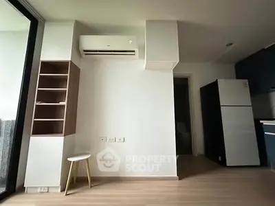 Modern apartment interior with air conditioning and sleek kitchen appliances