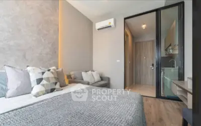 Modern bedroom with cozy decor and air conditioning in a stylish apartment.