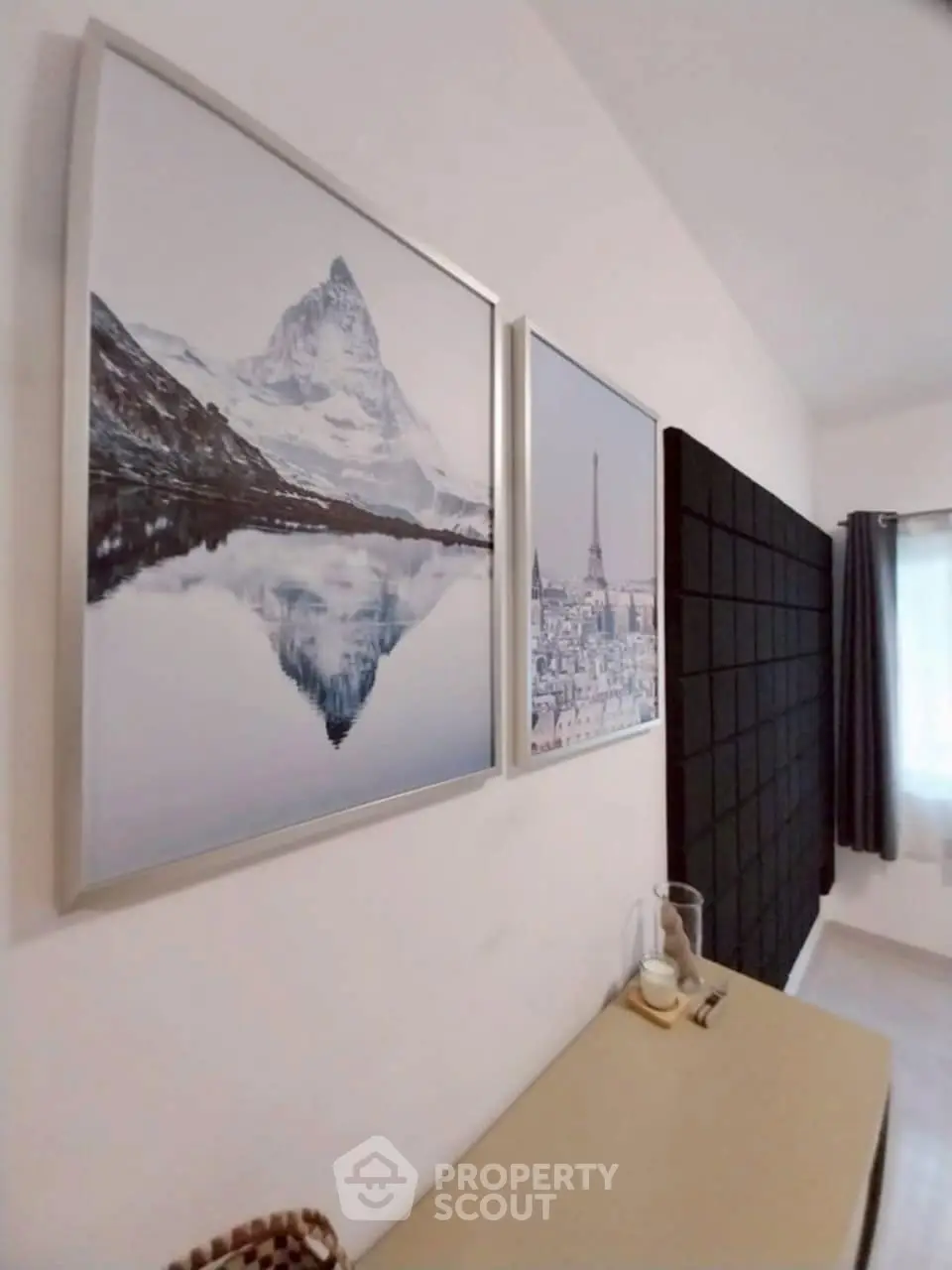 Stylish interior with framed art and modern decor in a cozy room.