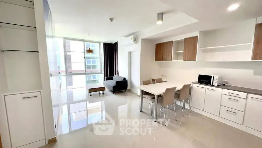 Spacious modern living room with open kitchen in bright apartment