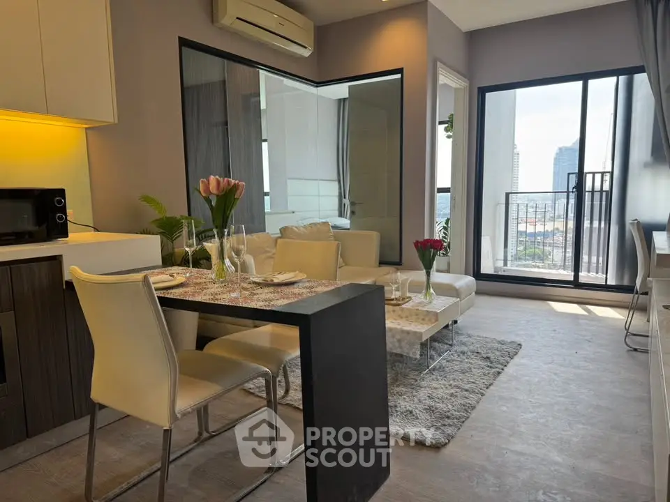 Modern living room with dining area and city view balcony