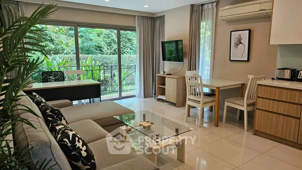 Spacious living room with modern decor and garden view, perfect for relaxation.