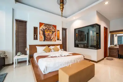 Luxurious bedroom with modern decor and unique artwork in a stylish home