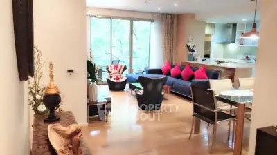 Spacious modern living room with stylish decor and open kitchen layout