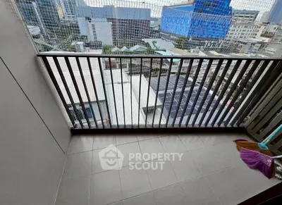 Urban balcony with city view, perfect for enjoying the skyline.