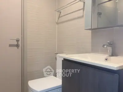 Modern bathroom with sleek fixtures and neutral tones