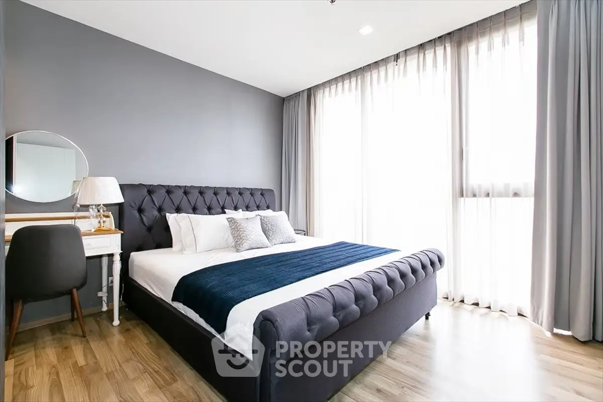 Luxurious bedroom with elegant decor and natural light