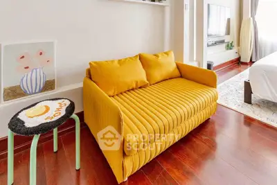 Chic living room with vibrant yellow sofa and modern decor