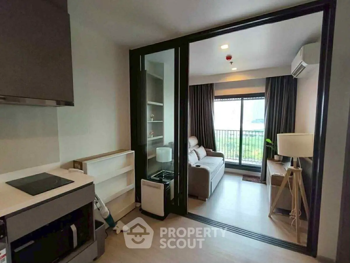 Modern apartment with sliding glass doors and cozy living area