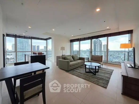 Spacious living room with panoramic city views and modern furnishings