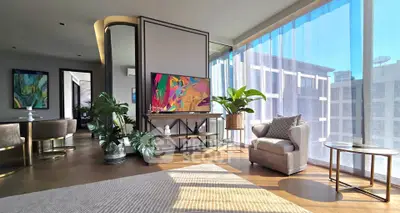 Luxurious modern living room with floor-to-ceiling windows and stylish decor