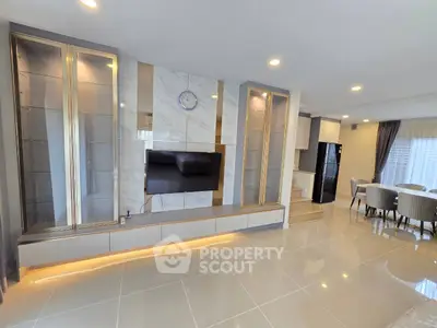 Luxurious open-plan living room with elegant decor and modern amenities