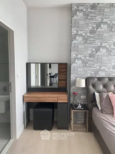 Stylish bedroom with modern vanity and chic wallpaper design