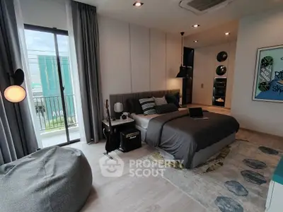 Modern bedroom with stylish decor and natural light from large window