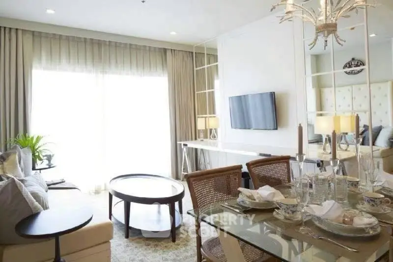 Elegant living room with dining area, modern decor, and natural light.