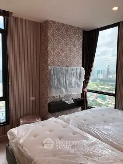Luxurious bedroom with stunning city view and elegant decor