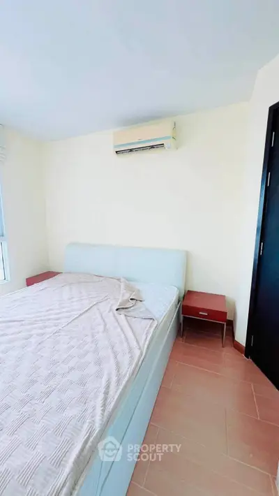 Cozy bedroom with modern air conditioning and stylish decor