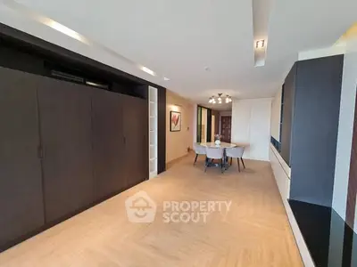 Spacious modern living room with elegant dining area and stylish lighting