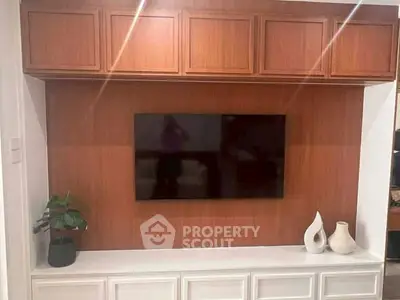 Stylish living room with mounted TV and elegant cabinetry