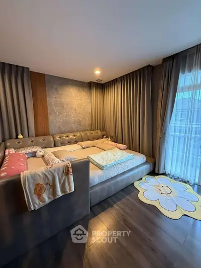 Cozy bedroom with large bed and stylish decor, perfect for relaxation.