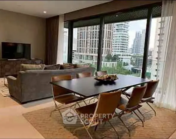 Luxurious living room with modern dining set and stunning city view.