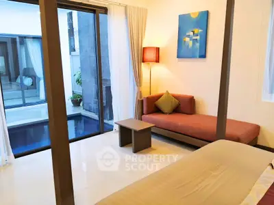 Luxurious bedroom with pool view and modern decor in a stylish home