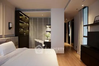 Modern bedroom with elegant decor and cozy workspace, featuring sleek furniture and ambient lighting.