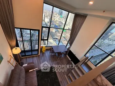 Stunning high-rise living room with panoramic city views and modern decor