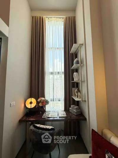 Chic study nook with tall windows and elegant decor in modern apartment