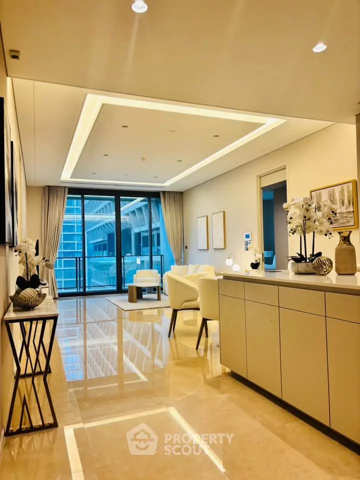 Luxurious modern living room with elegant decor and large windows offering stunning city views.