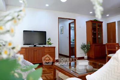 Spacious living room with wooden furniture and modern decor