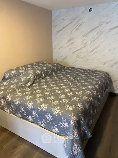 Cozy bedroom with stylish floral bedding and modern decor