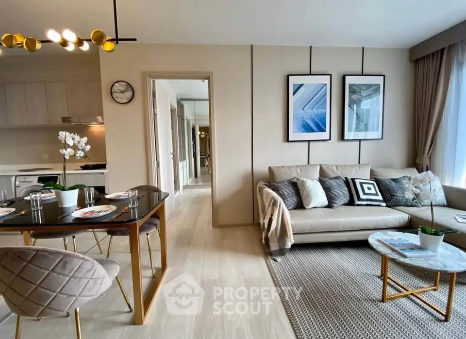 Modern living room with stylish decor and open kitchen layout