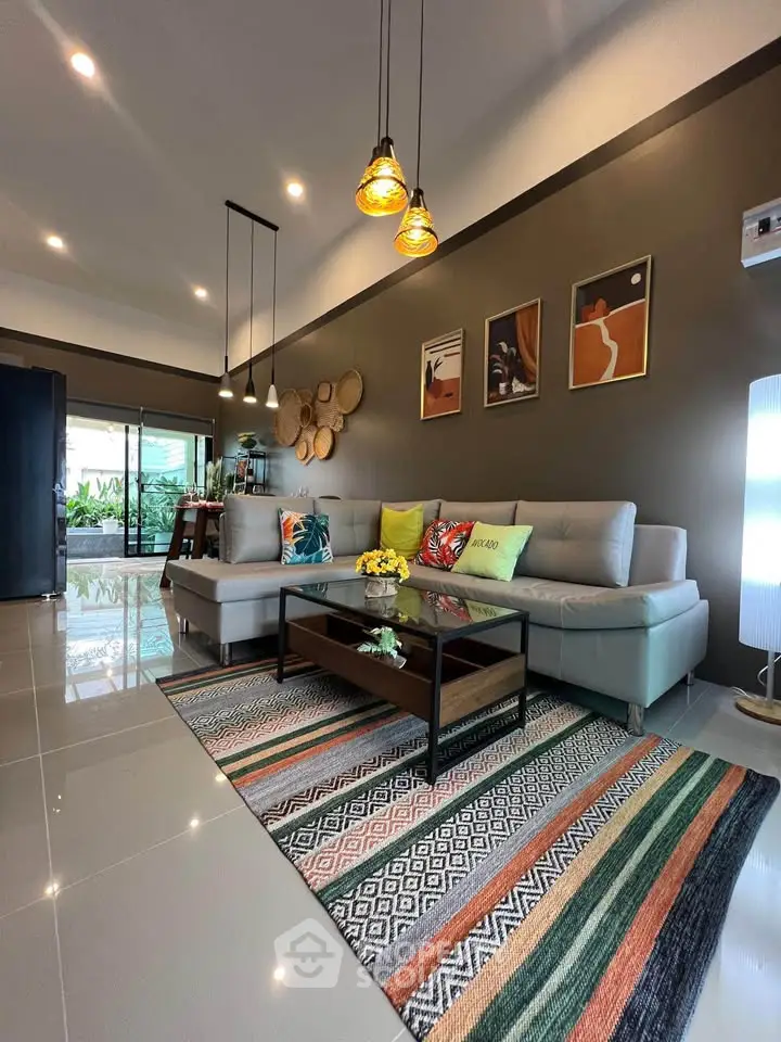 Modern living room with stylish decor, cozy sectional sofa, and vibrant accents, perfect for relaxation and entertaining.