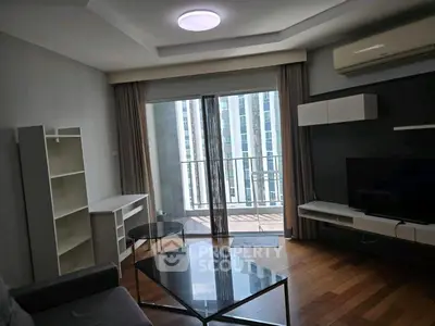 Modern living room with balcony view in high-rise apartment