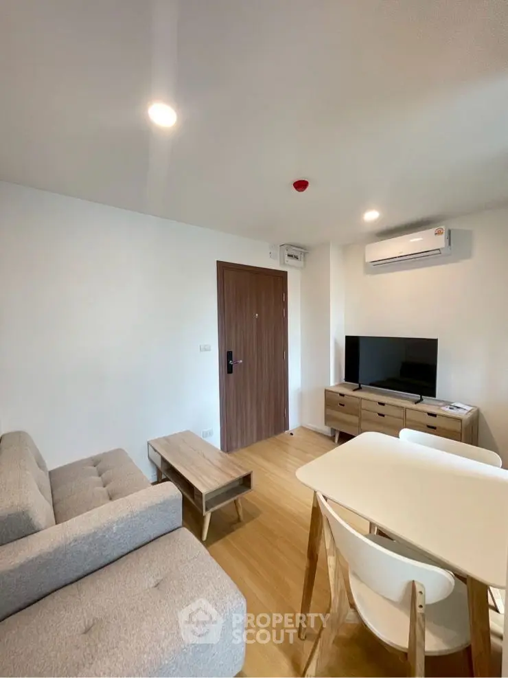 Modern living room with stylish furniture and air conditioning