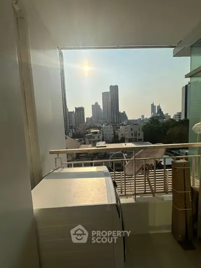 Stunning city view from a modern balcony with washing machine