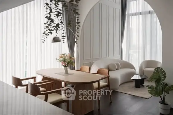 Elegant modern living room with stylish furniture and natural light