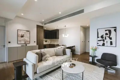 Modern living room with stylish decor and open kitchen layout