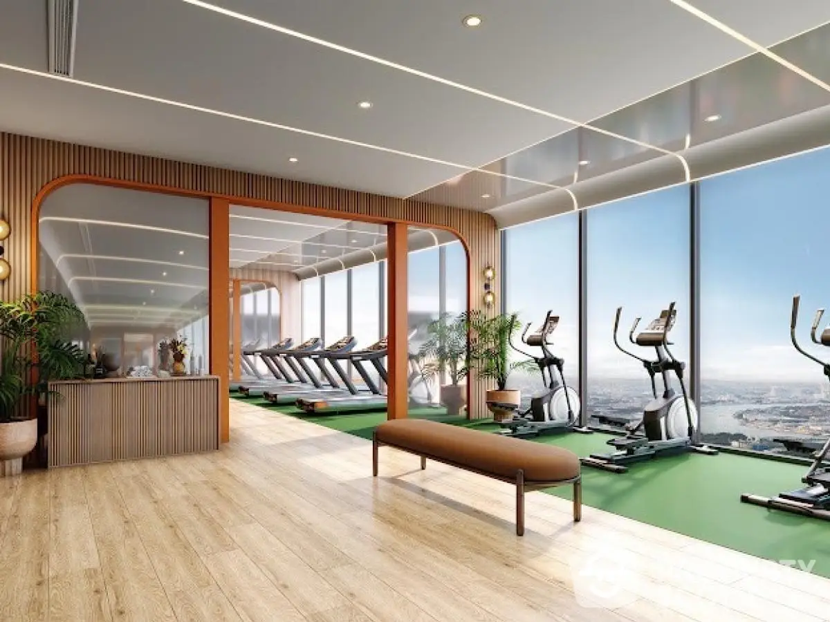 Luxurious gym with panoramic city views and modern exercise equipment.