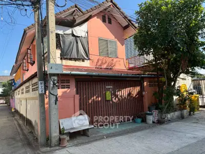 Charming two-story house with a rustic exterior and spacious front area, perfect for family living.