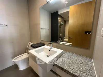 Modern bathroom with sleek design and granite countertop