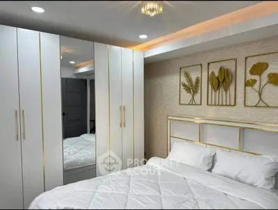 Luxurious bedroom with elegant decor and spacious wardrobe, perfect for modern living.