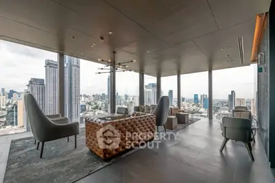 Luxurious high-rise living room with panoramic city views and elegant furnishings.